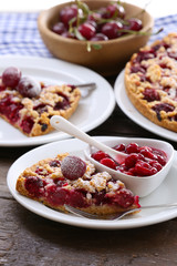 Fototapeta na wymiar Tasty homemade pie with cherries on table close up