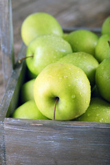 Ripe green apple in crate close up