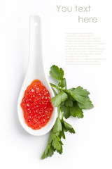 Spoon of red caviar isolated