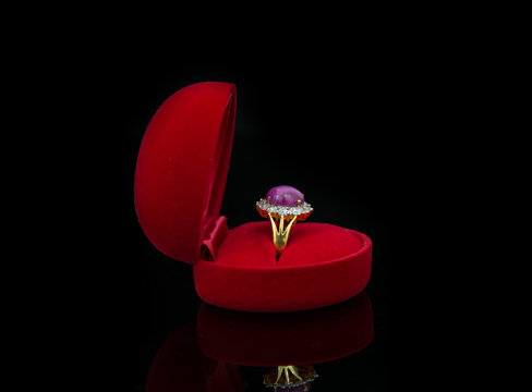 Ring of the jewelry in a gift box on black background