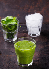 Green smoothie with spinach and kiwi, vitamin cocktail with ice.