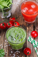 Tomato juice and green smoothies with spinach, kiwi and Apple.selective focus