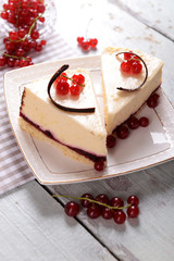 Tasty cheesecake with berries on table close up