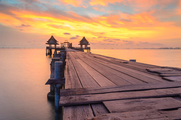 Wooded bridge in the port and sunset