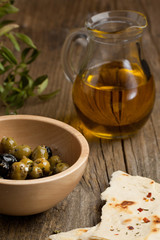 Olive oil with olives and bread