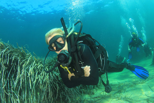 Blonde woman scuba diver