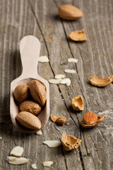 Almonds on white wood