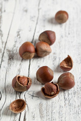 hazelnuts on white wood