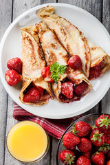 Traditional crepes served with strawberries