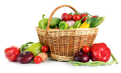 Heap of fresh fruits and vegetables  in basket isolated on white