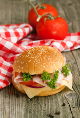 Fresh sandwich with ham and tomatoes