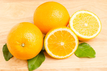 Fototapeta na wymiar Navel orange fruit on wooden background