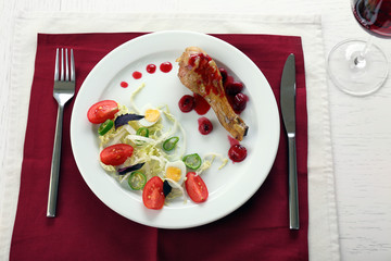 Tasty dinner served with wine on table close up