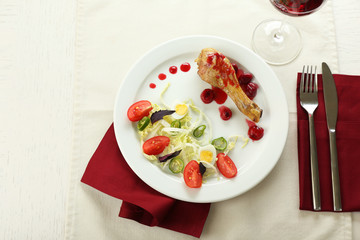 Tasty dinner served with wine on table close up