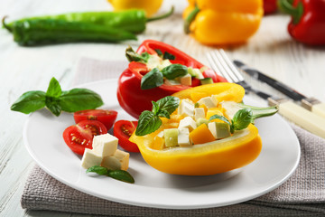 Fresh green salad in pepper on table close up