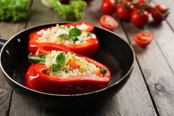 Stuffed peppers with vegetables on table close up