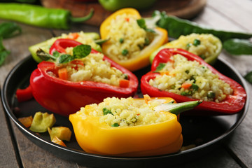 Stuffed peppers with vegetables on table close up