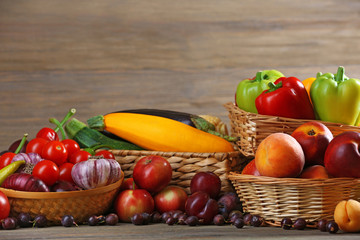 Heap of fresh fruits and vegetables on wooden background