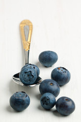 Spoon with fresh blueberries