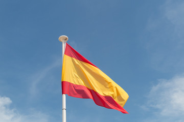 Spanish flag under blue sky