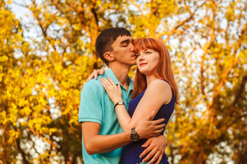 Fototapeta premium Young couple hugging in forest outdoors