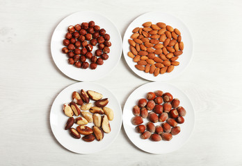 Collection of nuts on wooden background
