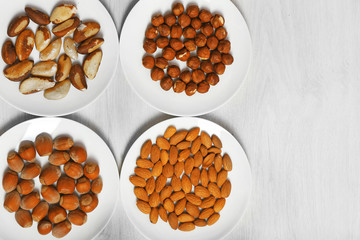 Collection of nuts on wooden background