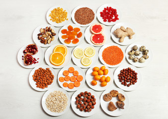 Set of orange products on wooden background