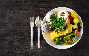 Still life above view of salad on wood table