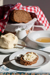 Fresh bread with butter and honey