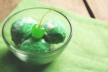 Homemade mint ice-cream on wooden background