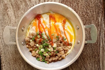Breakfast with fried eggs on pan