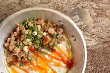 Breakfast with fried eggs on pan