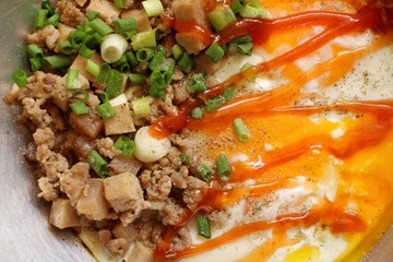 Breakfast with fried eggs on pan