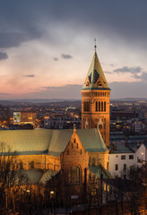 Obraz premium Krakow, Poland, Romanesque revival Church of Our Lady of Perpetual Help in the evening, with a delicate artificial and natural light in the short break between downpours