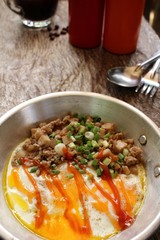 Breakfast with  fried eggs on pan and hot coffee