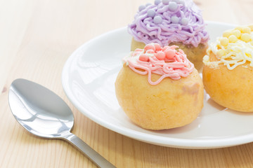 Highlight at Red Choux or Profiterole or Eclair in White Dish an