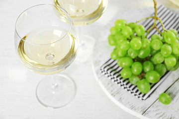 Still life of wine and bread on light background