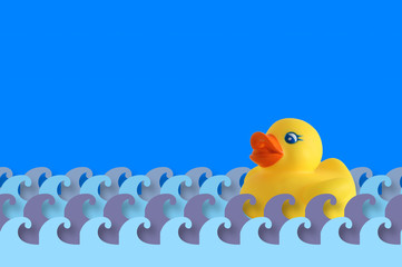 Rubber duck floating on some water waves made of paper. A background representing child care and bathroom time. Empty copy space for editor's text.