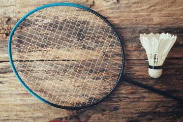 Shuttlecocks with badminton racket.