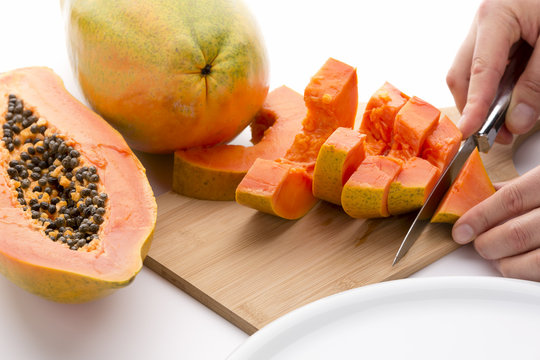 Cutting A Papaya Quarter Into Six Slices