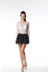 Portrait of a beautiful slim model in black skirt and white blou