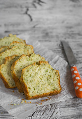 cake with cheese and herbs on a light wooden surface