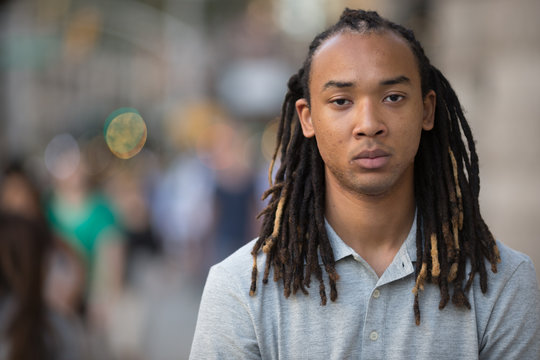 Young African American Asian man serious face portrait