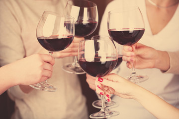 Woman hands with glasses of wine close-up