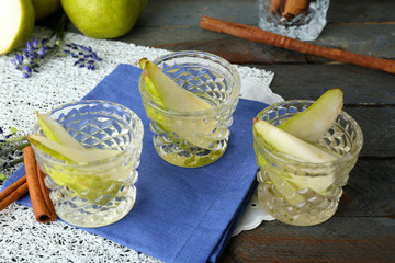 Pear juice with fresh fruits on table close up