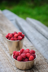 White can and mug with fresh raspberry