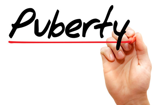 Hand writing Puberty with marker, concept
