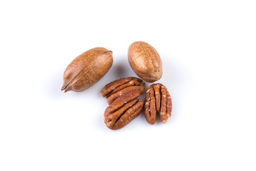 Few pecan nuts isolated on white