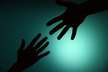 Silhouette of hands close up